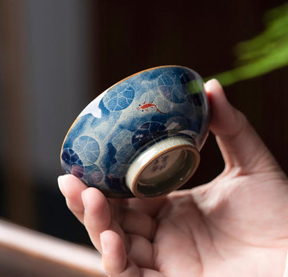 Handcrafted Jian Zhan Jingdezhen Porcelain Tea Cup with Blue & White Lotus Fish Design