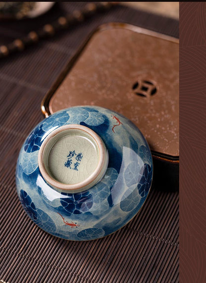 Handcrafted Jian Zhan Jingdezhen Porcelain Tea Cup with Blue & White Lotus Fish Design