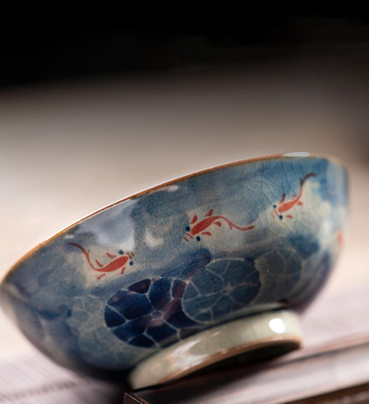 Handcrafted Jian Zhan Jingdezhen Porcelain Tea Cup with Blue & White Lotus Fish Design