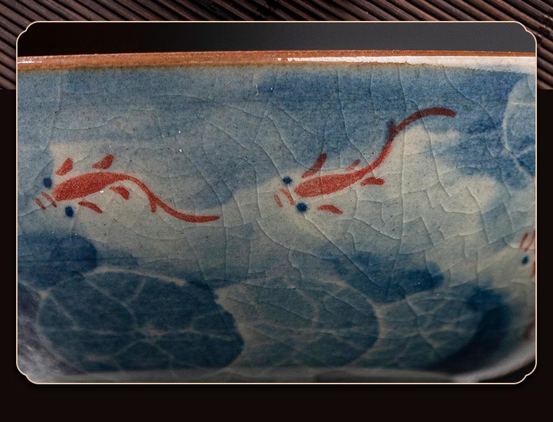 Handcrafted Jian Zhan Jingdezhen Porcelain Tea Cup with Blue & White Lotus Fish Design
