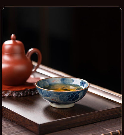 Handcrafted Jian Zhan Jingdezhen Porcelain Tea Cup with Blue & White Lotus Fish Design